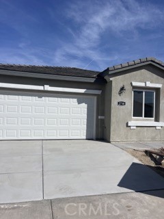 a front view of a house with garage