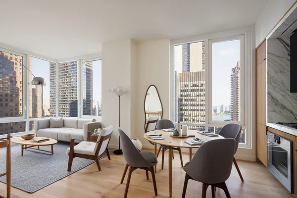 a view of a dining room with furniture window and outside view