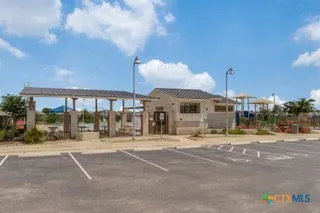 a outdoor view of a building with traffic signal lights