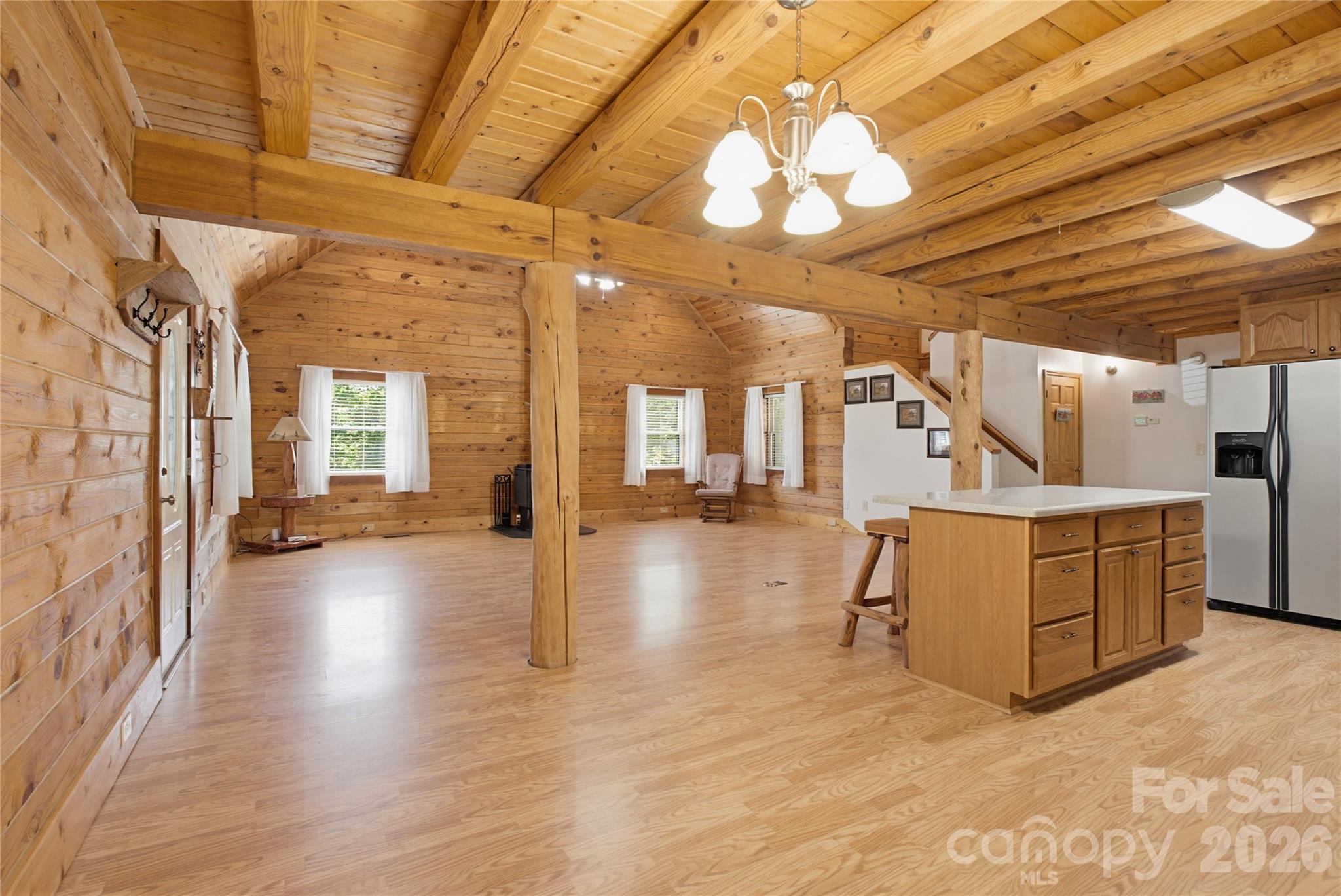 451 Rustic Ridge Drive Canton, NC 28716 - Photo 8 of 44 a view of a room with lots of wooden furniture and windows