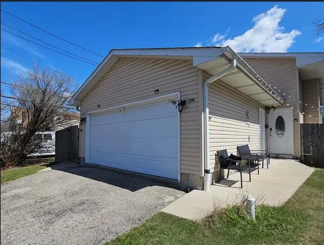 a view of a patio with table and chairs and potted plants