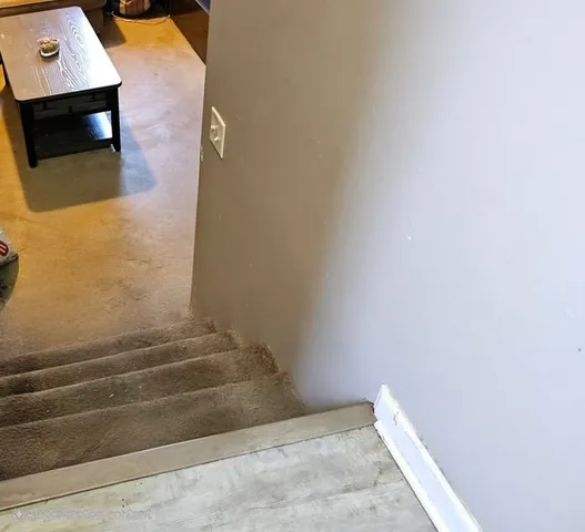 an aerial view of a house with outdoor space and lake view