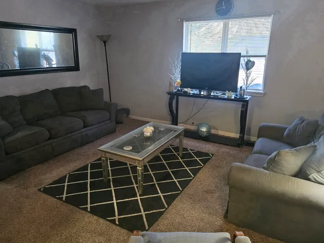 a bathroom with a sink toilet and mirror