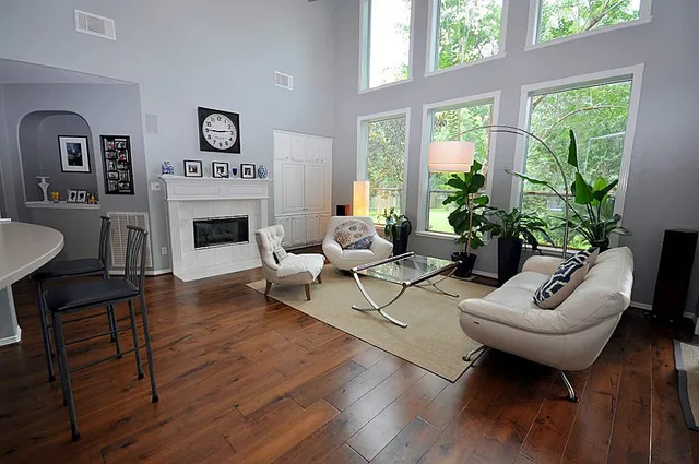 a living room with furniture and a fireplace