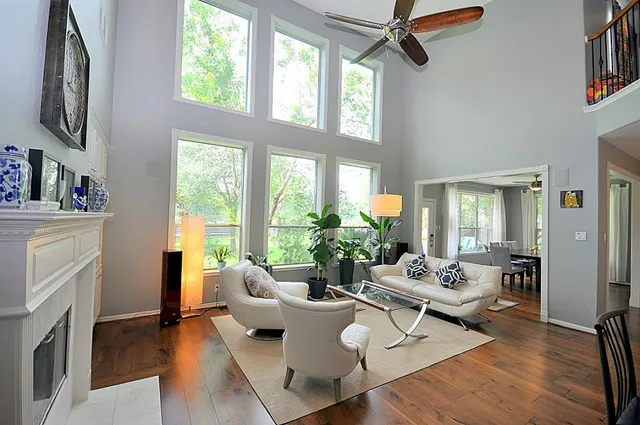 a living room with furniture and a fireplace