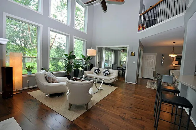 a living room with furniture and a large window