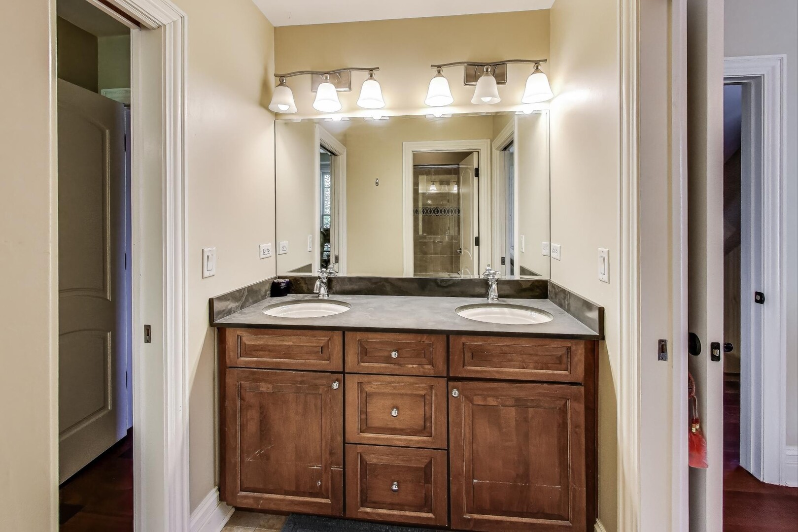901 Pontiac Road Wilmette, IL 60091 - Photo 19 of 35 a bathroom with a granite countertop sink and a mirror