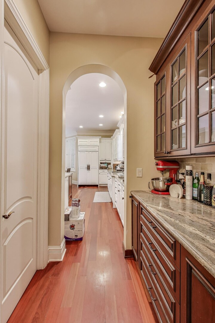 901 Pontiac Road Wilmette, IL 60091 - Photo 6 of 35 a kitchen with sink refrigerator and cabinets