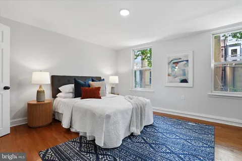 a bedroom with a large bed and a window