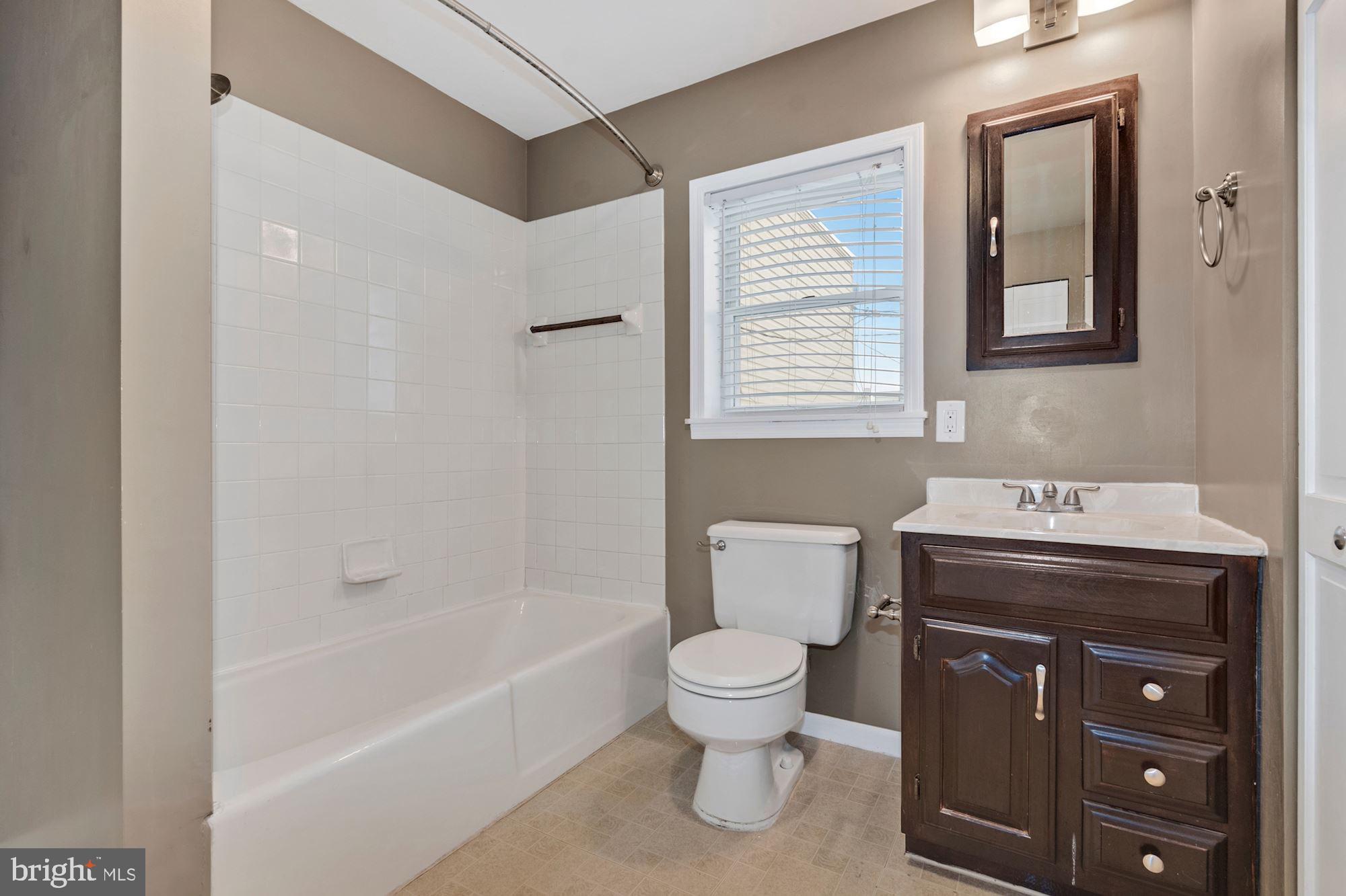 1445 Andre Street Baltimore, MD 21230 - Photo 14 of 22 a bathroom with a sink toilet and shower