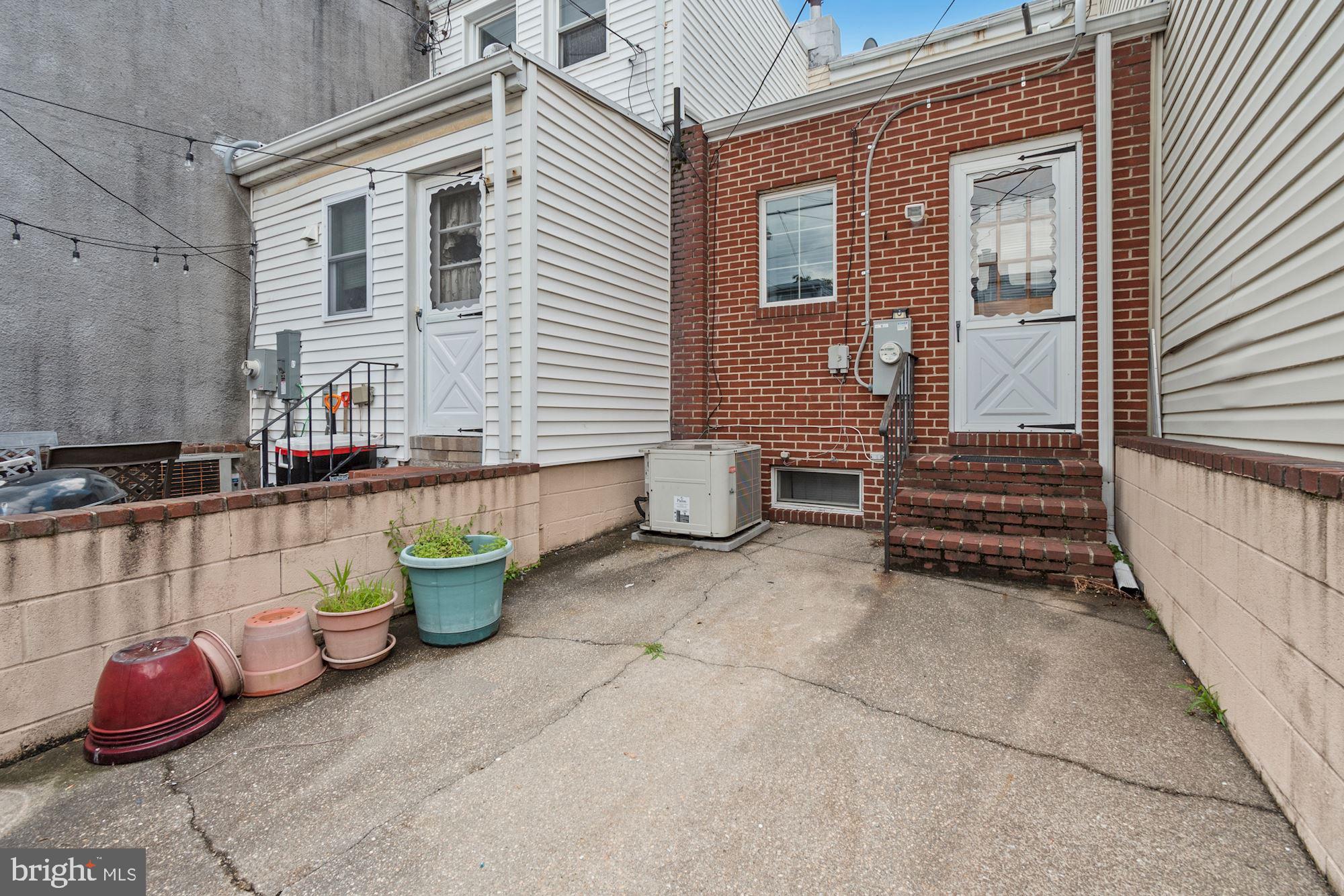 1445 Andre Street Baltimore, MD 21230 - Photo 21 of 22 a backyard of a house with outdoor seating