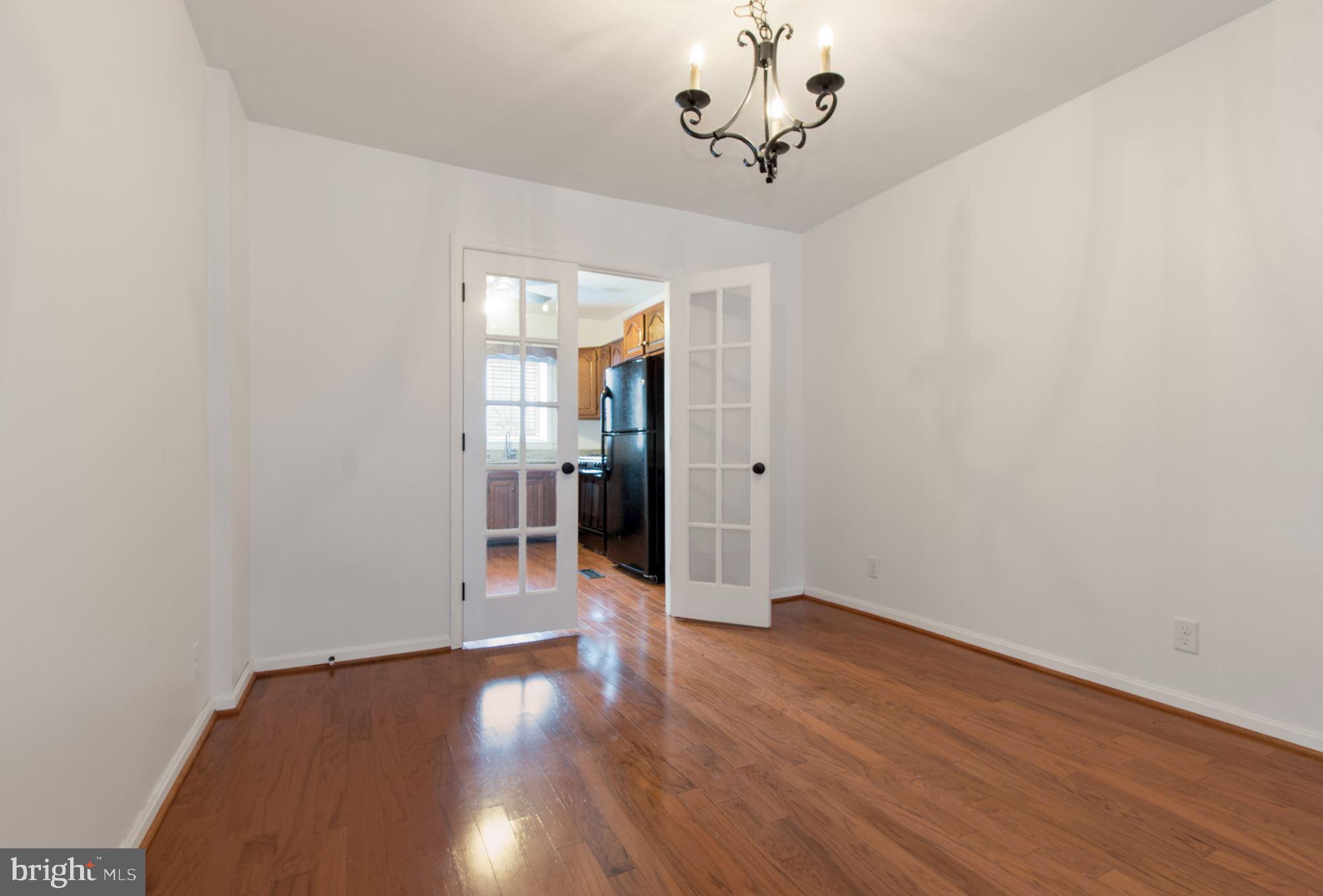 1445 Andre Street Baltimore, MD 21230 - Photo 5 of 22 a view of a room with wooden floor