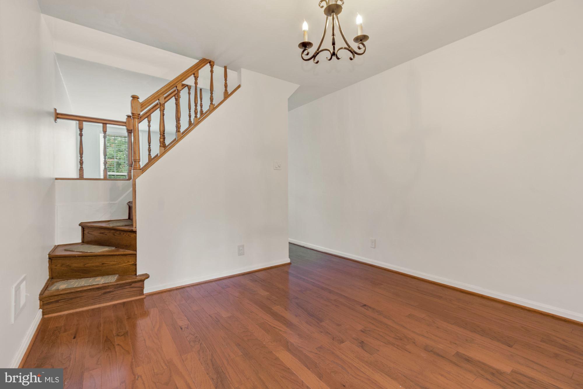 1445 Andre Street Baltimore, MD 21230 - Photo 7 of 22 a view of entryway with stairs and wooden floor