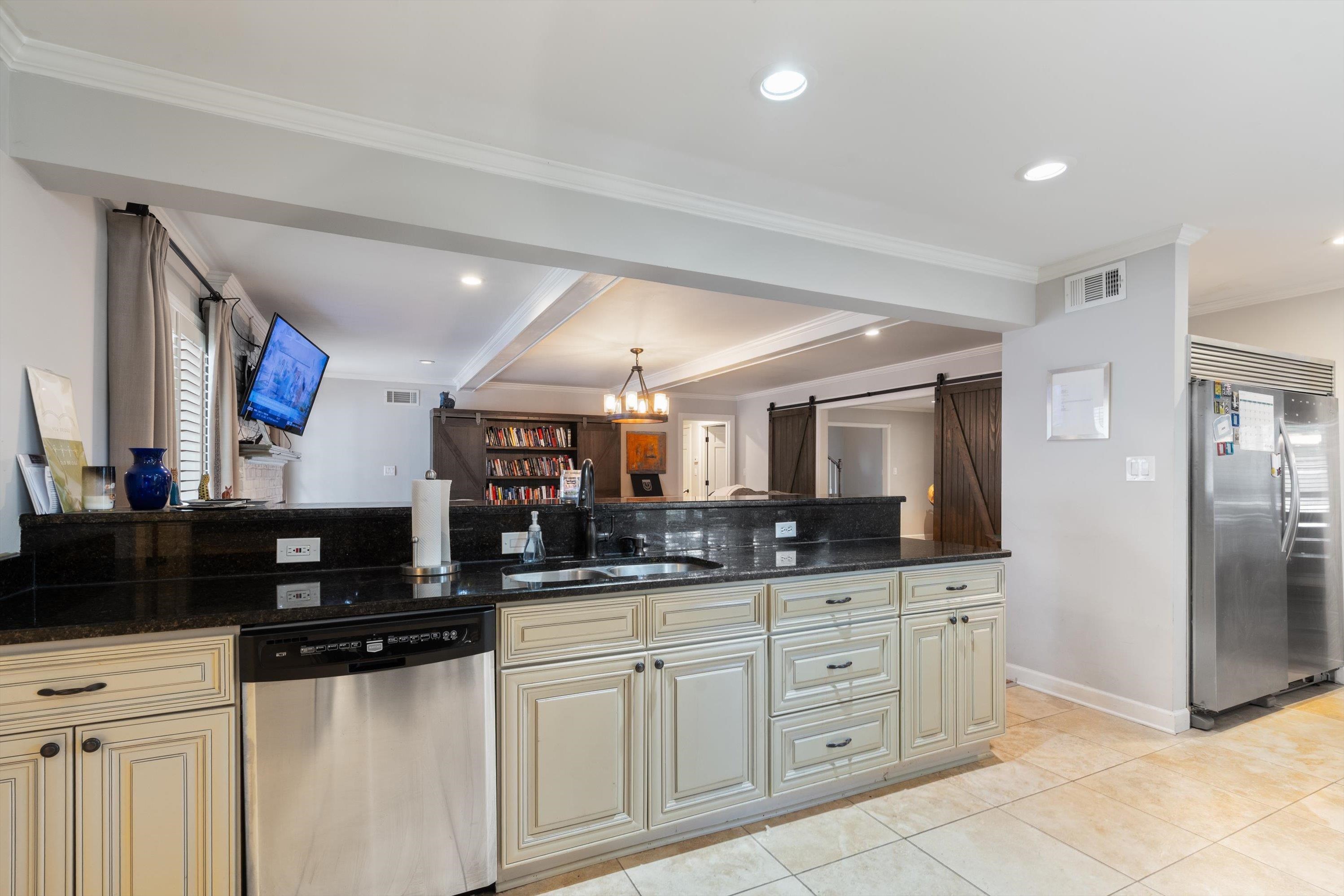 839 Reddoch Street Memphis, TN 38119 - Photo 12 of 36 a kitchen with granite countertop a sink and cabinets