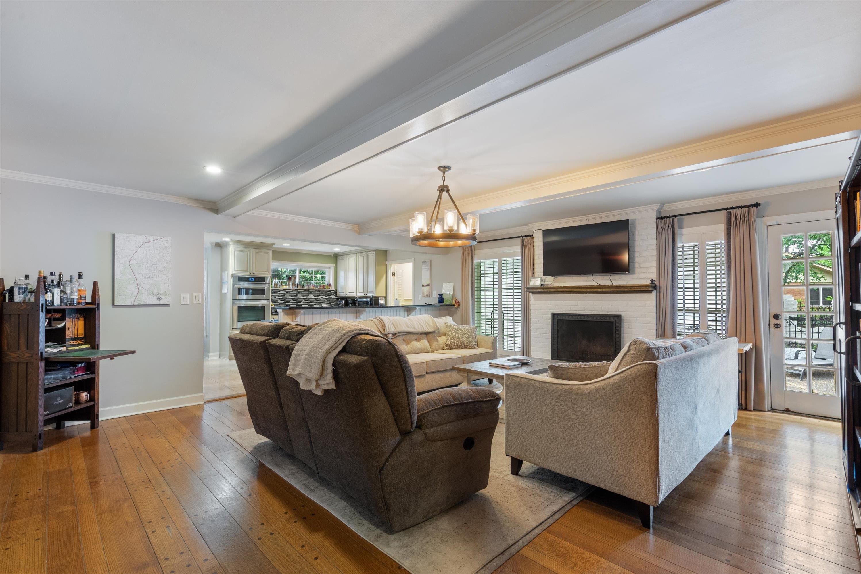 839 Reddoch Street Memphis, TN 38119 - Photo 14 of 36 a living room with furniture fireplace and flat screen tv