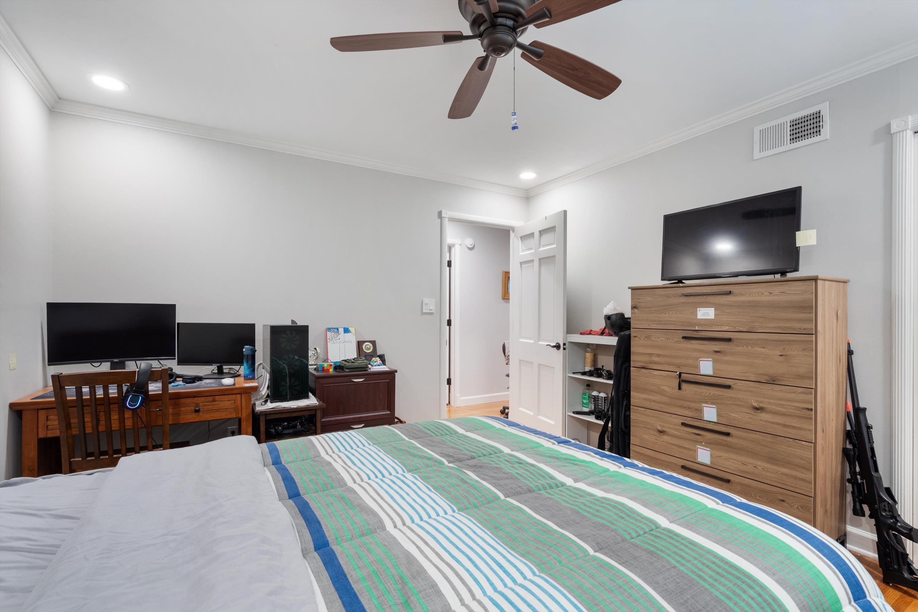 839 Reddoch Street Memphis, TN 38119 - Photo 21 of 36 a view of a livingroom with furniture and a flat screen tv