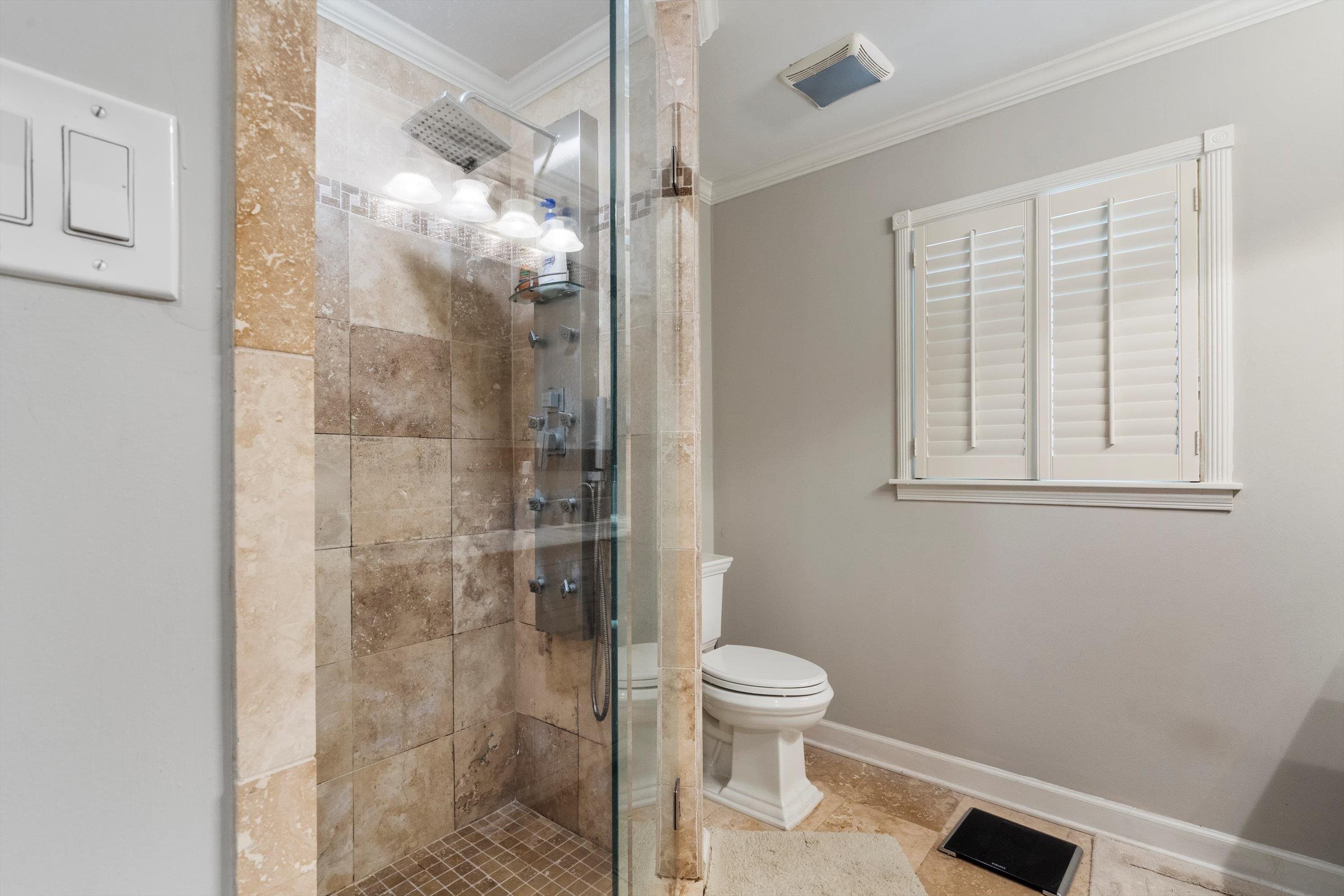 839 Reddoch Street Memphis, TN 38119 - Photo 25 of 36 a bathroom with a toilet and a shower