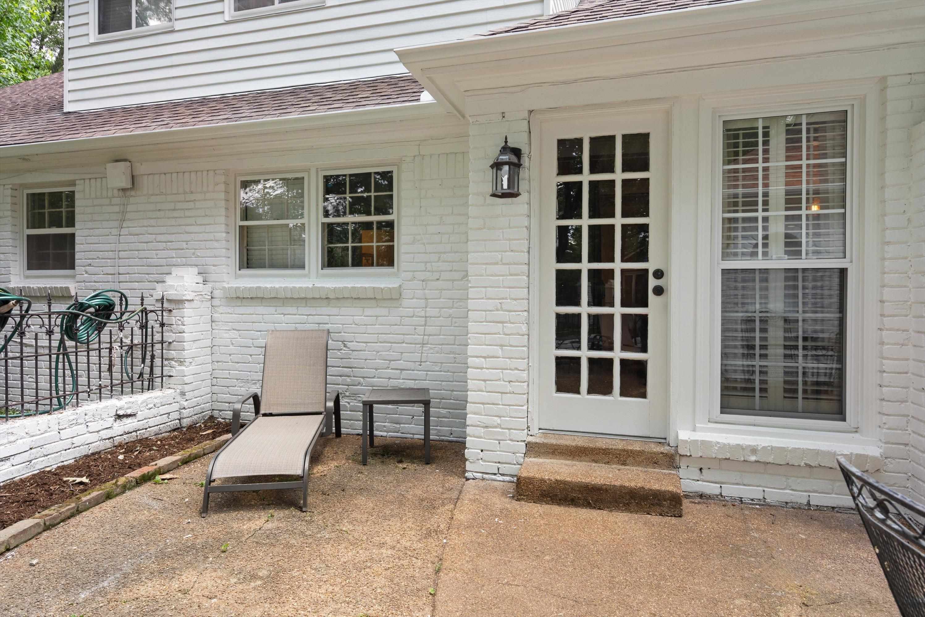839 Reddoch Street Memphis, TN 38119 - Photo 33 of 36 a view of a house with a barbeque and wooden fence