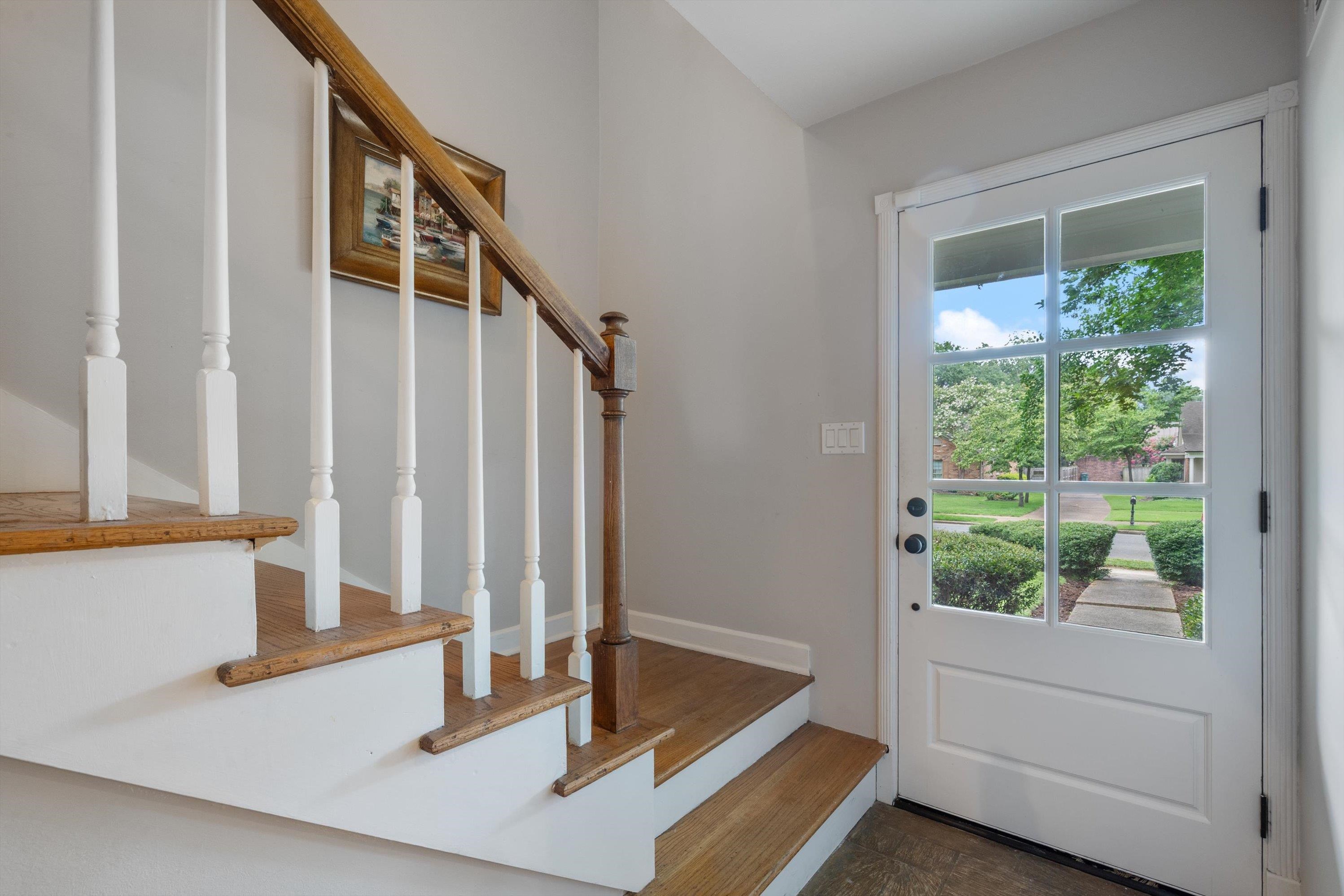 839 Reddoch Street Memphis, TN 38119 - Photo 5 of 36 a view of staircase with furniture and a window
