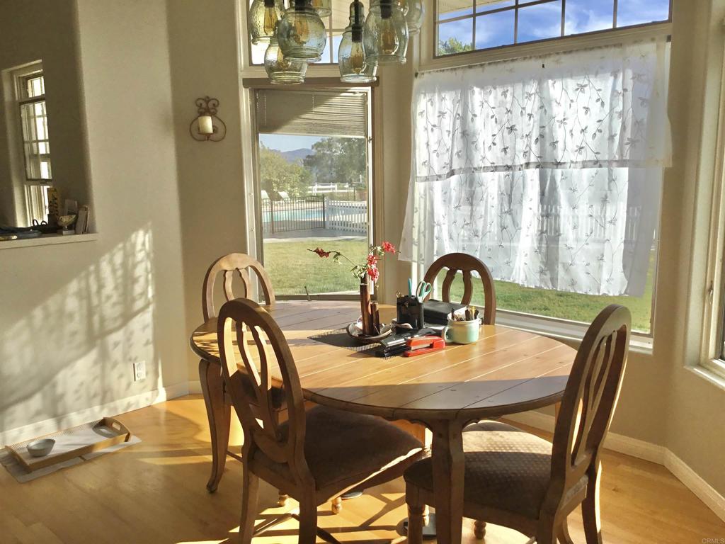622 Rancho Del Cerro Fallbrook, CA 92028 - Photo 14 of 58 a view of a dining room with furniture and window