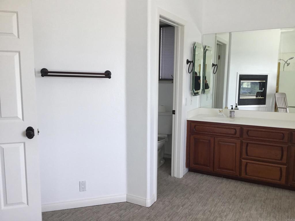 622 Rancho Del Cerro Fallbrook, CA 92028 - Photo 17 of 58 a bathroom with a double vanity sink and mirror