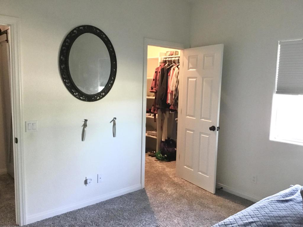 622 Rancho Del Cerro Fallbrook, CA 92028 - Photo 23 of 58 a view of a livingroom with furniture and a mirror