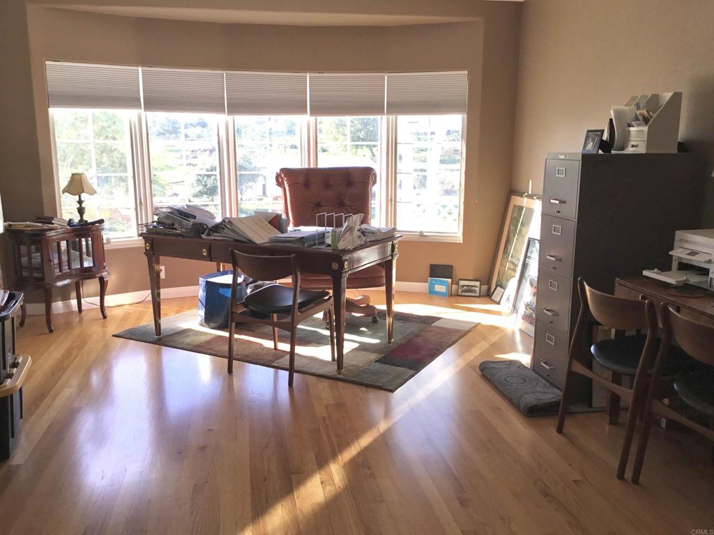 622 Rancho Del Cerro Fallbrook, CA 92028 - Photo 24 of 58 a view of a dining room with furniture window and wooden floor