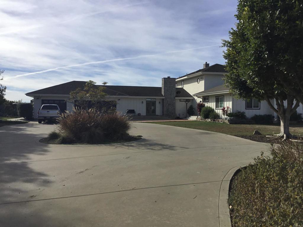 622 Rancho Del Cerro Fallbrook, CA 92028 - Photo 3 of 58 a street view with residential house and car parked