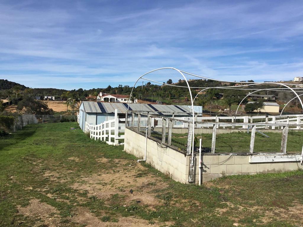 622 Rancho Del Cerro Fallbrook, CA 92028 - Photo 40 of 58 a view of a lake with a house in the background
