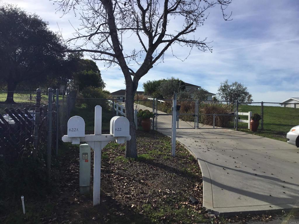 622 Rancho Del Cerro Fallbrook, CA 92028 - Photo 58 of 58 a front view of a house with a yard and covered with snow