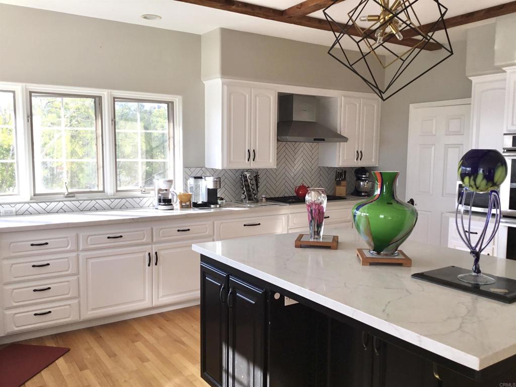 622 Rancho Del Cerro Fallbrook, CA 92028 - Photo 10 of 58 a kitchen with cabinets a window and appliances