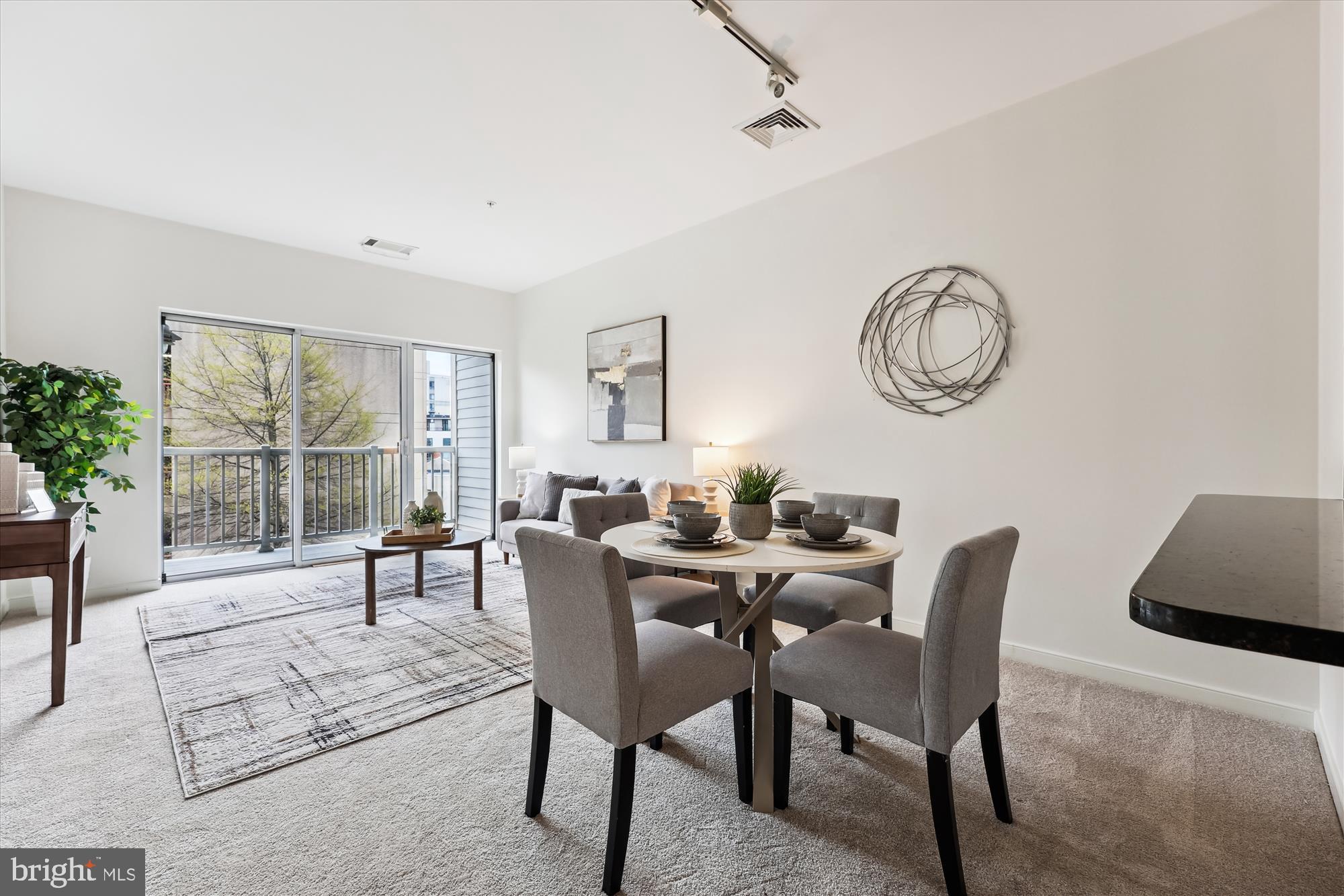 8045 Newell Street, Unit 319 Silver Spring, MD 20910 - Photo 18 of 66 a view of a livingroom with furniture and window