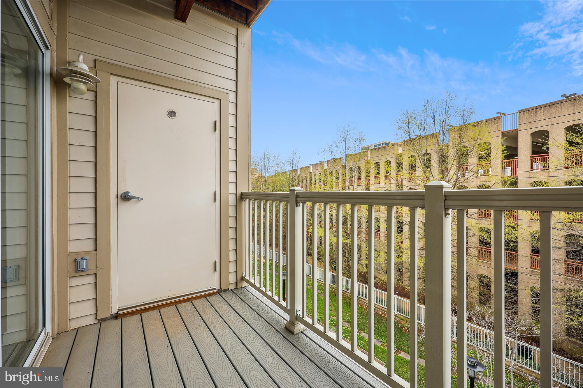 8045 Newell Street, Unit 319 Silver Spring, MD 20910 - Photo 21 of 66 a view of a balcony with wooden floor