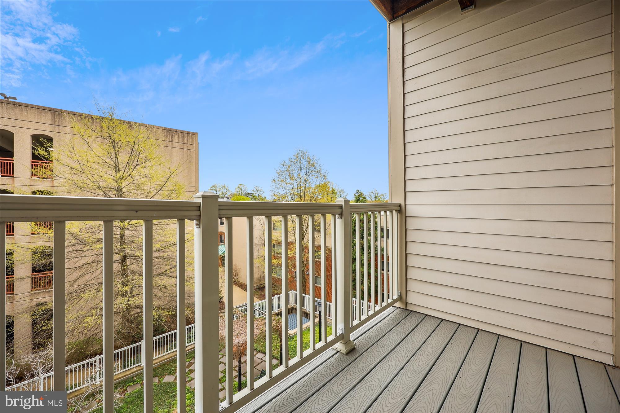 8045 Newell Street, Unit 319 Silver Spring, MD 20910 - Photo 22 of 66 a view of a balcony with wooden floor