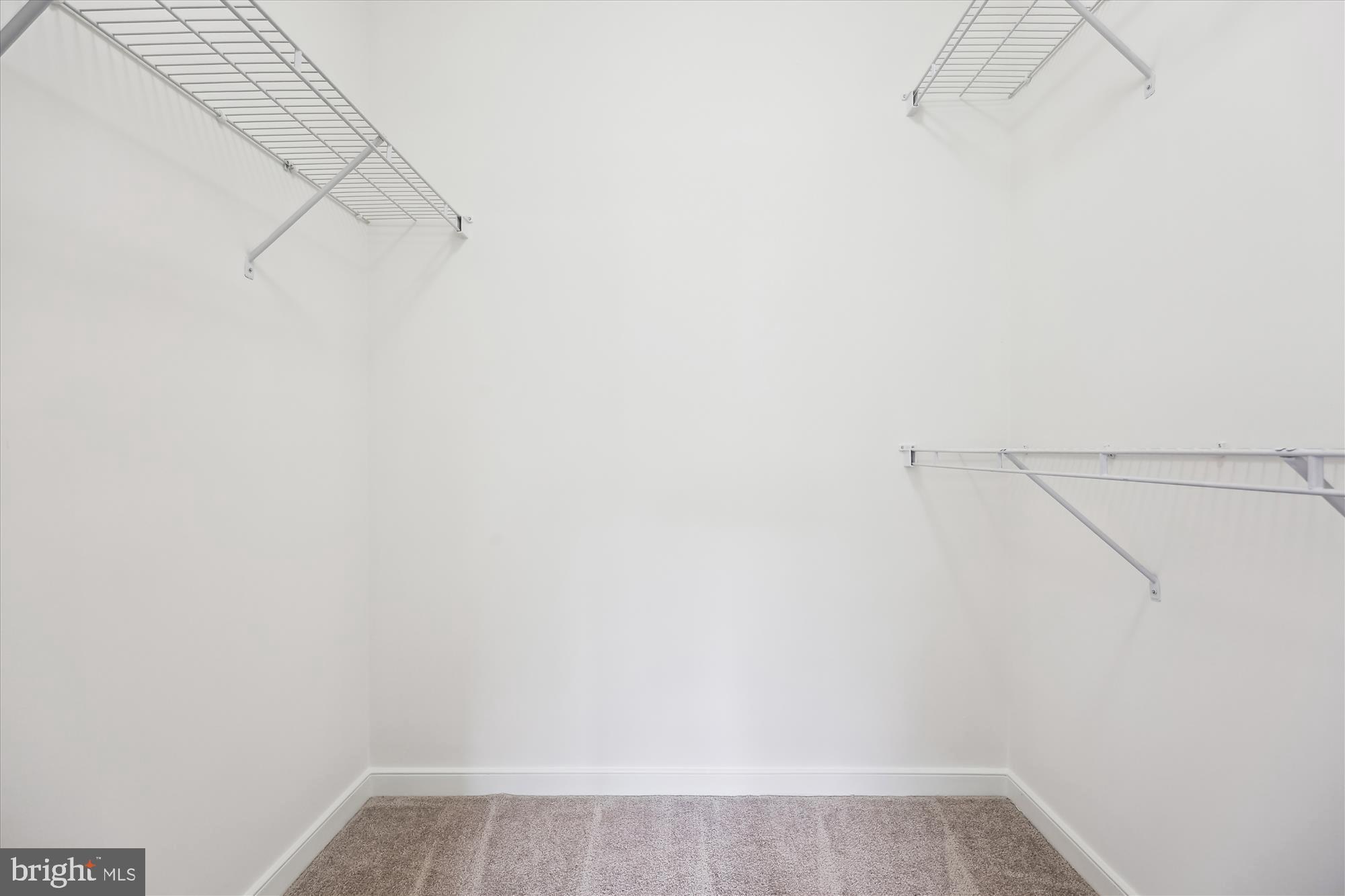 8045 Newell Street, Unit 319 Silver Spring, MD 20910 - Photo 32 of 66 a view of a room with racks on the wall