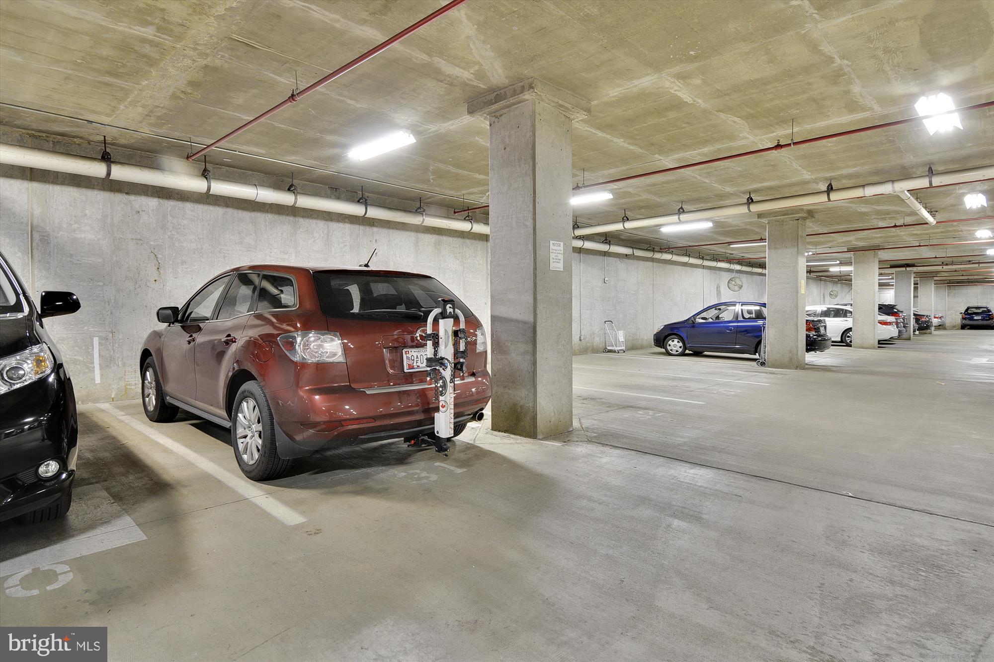 8045 Newell Street, Unit 319 Silver Spring, MD 20910 - Photo 37 of 66 a view of parking garage with cars