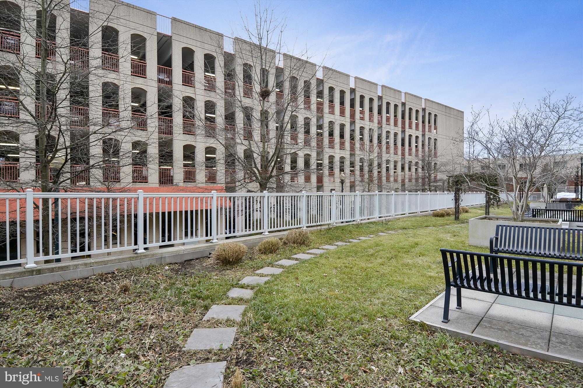 8045 Newell Street, Unit 319 Silver Spring, MD 20910 - Photo 43 of 66 a view of a brick building from a backyard