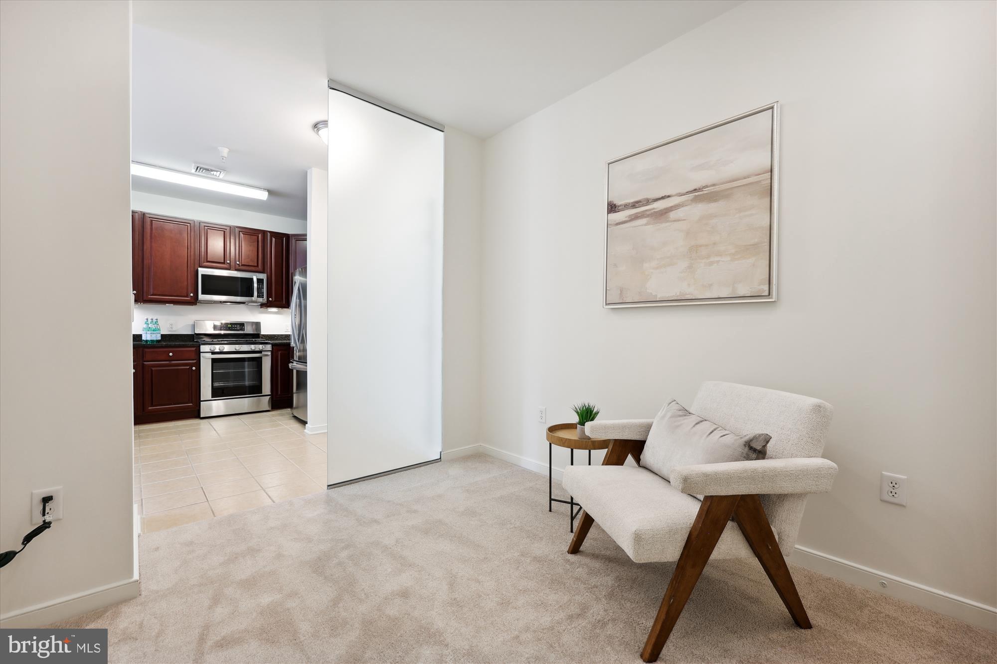 8045 Newell Street, Unit 319 Silver Spring, MD 20910 - Photo 7 of 66 a room with furniture and a window