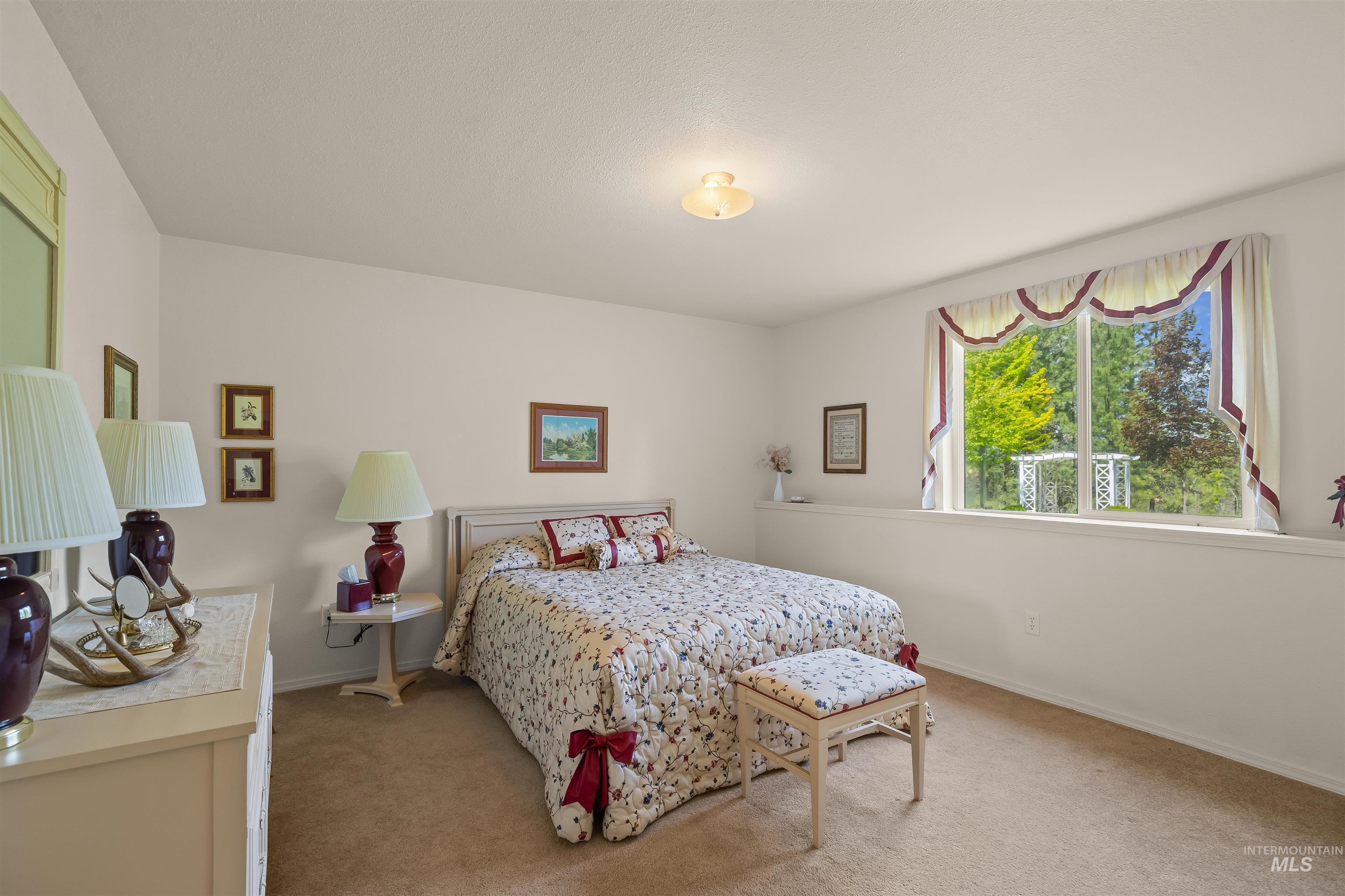 743 Wall Crk Road Stites, ID 83552 - Photo 39 of 48 Spacious room featuring neutral carpeting and light-toned wall finishes