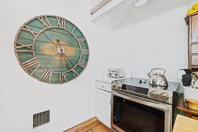 a bedroom with a bed and windows