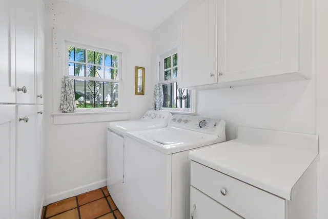 a bedroom with a bed wooden floor and a table