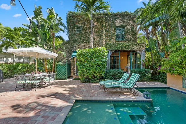 a bathroom with a sink mirror vanity and toilet