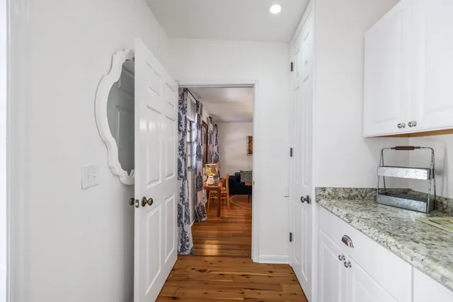 a view of a balcony with wooden floor and city view