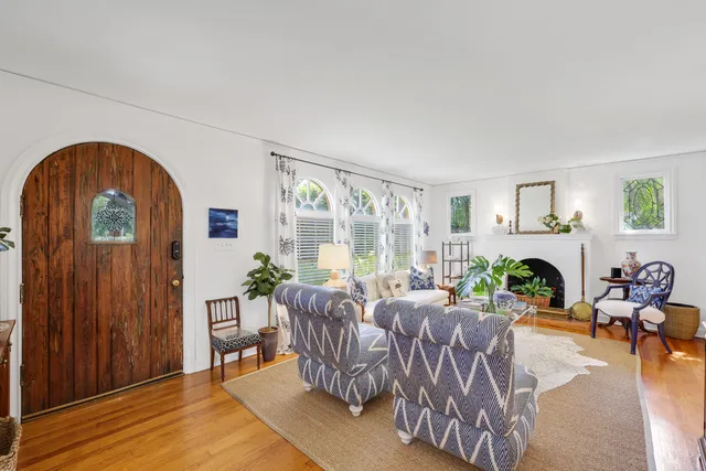 a living room with furniture and a rug