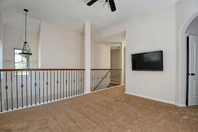 a view of a living room and a flat screen tv