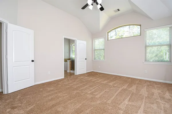 an empty room with windows and closet