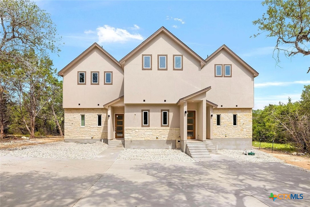 155 North Rip Ford Road, Unit B Spring Branch, TX 78070 - Photo 1 of 17 a view of a white house