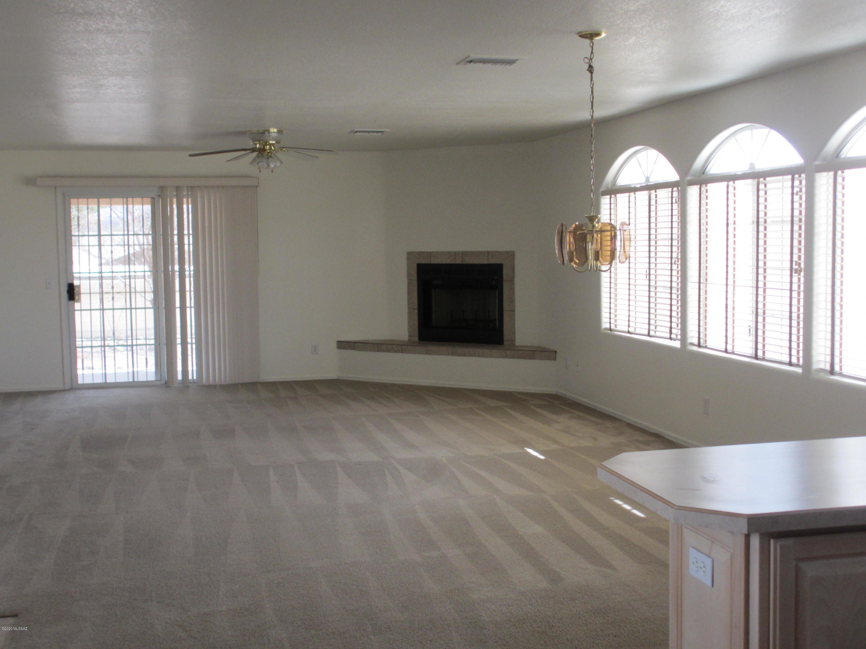 453 Chalet Court Rio Rico, AZ 85648 - Photo 5 of 26 a view of an empty room with a window