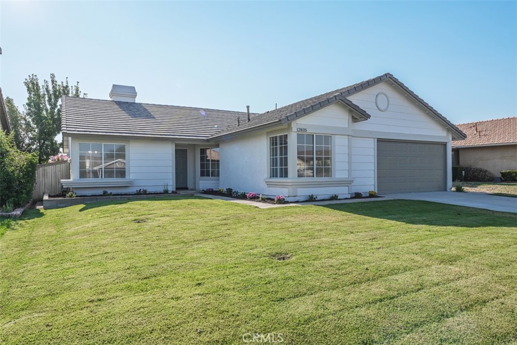 12835 Pacoima Road Victorville, CA 92392 - Photo 1 of 1 a front view of a house with a yard