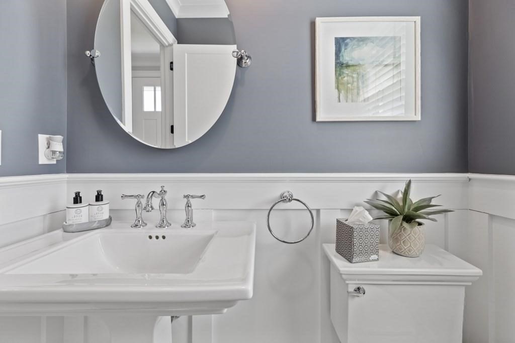 7 Waterville Lane, Unit 7 Hopkinton, MA 01748 - Photo 11 of 31 a bathroom with a sink and a mirror